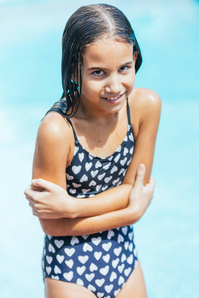 Little girl getting cold out of the pool water after bath - Photo, image