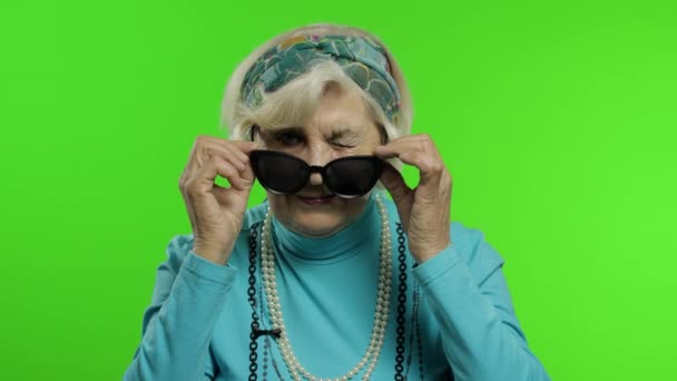 Elderly stylish trendy grandmother. Caucasian woman posing. Chroma key - Footage, Video