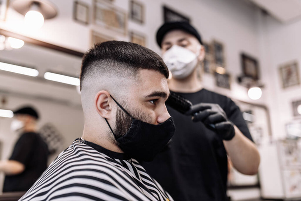 Mens haircut in a barbershop. Styling and hair care.  - Фото, зображення