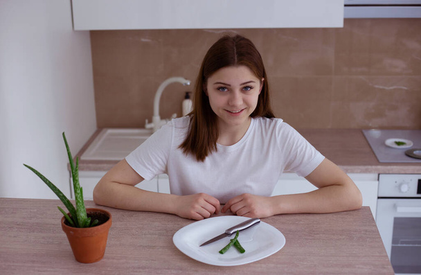 Young woman prepare to making healthy facial mask with aloe vera extract at home - Photo, Image