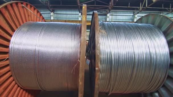 Cable factory. Metal, optical, copper, power wires are wound on huge coils. Products are used in the energy, transport, construction, engineering, nuclear, defense, oil and gas industries. - Footage, Video