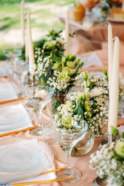 Festive table setting for the wedding venue. Peach summer decoration. - Photo, Image