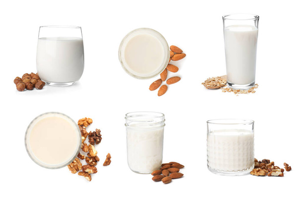 Set with different types of organic milk on white background. Natural drinks - Foto, Imagen