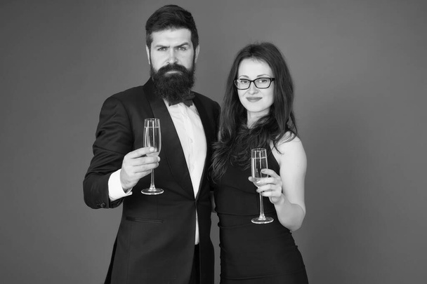Family celebrate Valentines day. Romantic relationship. Love concept. Celebrating their love. Occasion to celebrate. Couple in love drink sparkling wine. Attractive woman bearded man raise glasses - Foto, imagen