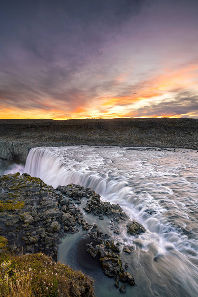 Detifoss waterfall with sunset in the background, Iceland - Photo, Image
