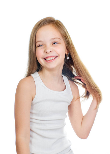 Young cute smiling girl with grey blue eyes and long light brown hair isolated on white background - Foto, immagini