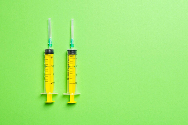 Top view of medical syringes on colorful background. Health care concept with copy space. - Photo, Image