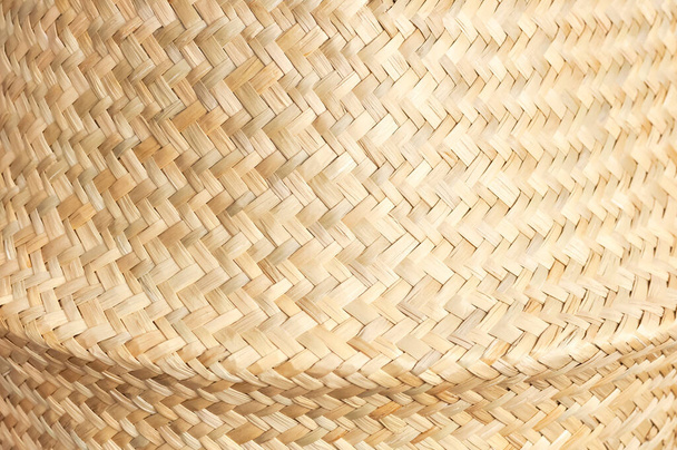 Texture of straw weaving closeup. Straw wicker basket. Fashionable bamboo basket, stylish interior item, eco design, handmade. Natural decor. Straw weave texture. Natural eco materials, storage basket. - Photo, Image
