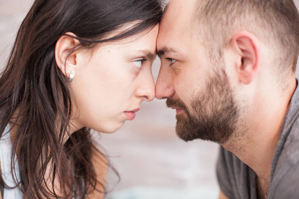 Close up of husband and wife looking into each other eyes - 写真・画像