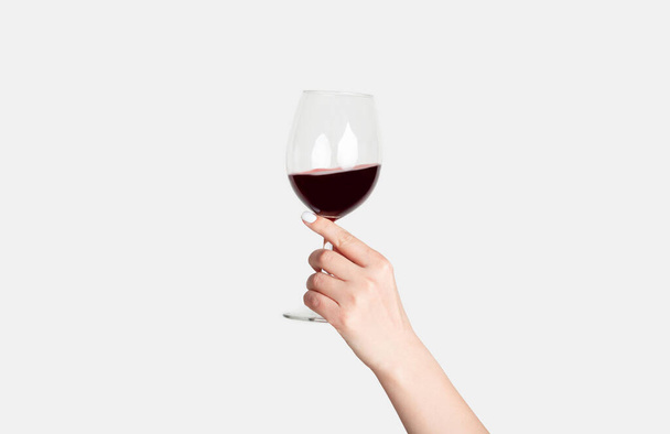 Young girl holding glass of tasty red wine on white background, closeup - Fotografie, Obrázek