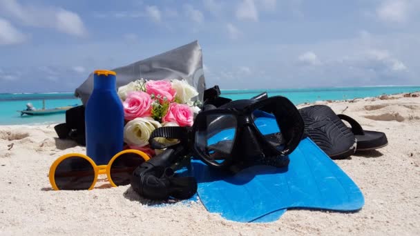 Diving set with wedding bouquet on sandy beach. Scenery of Seychelles, East Africa. - Footage, Video
