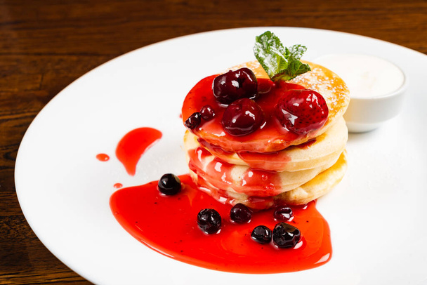 pancakes with berry sauce - Fotó, kép