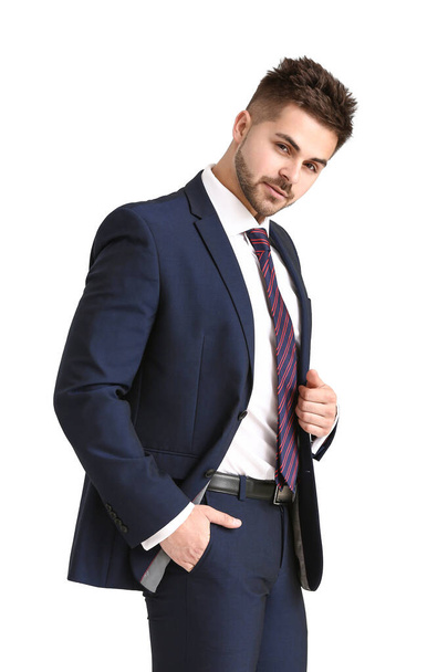 Handsome young man in elegant suit on white background - Foto, imagen