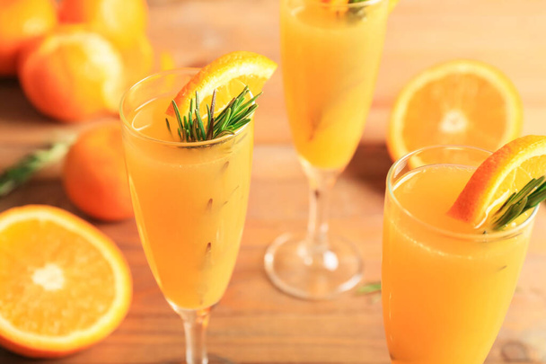 Glasses of tasty mimosa cocktail on table, closeup - Foto, immagini