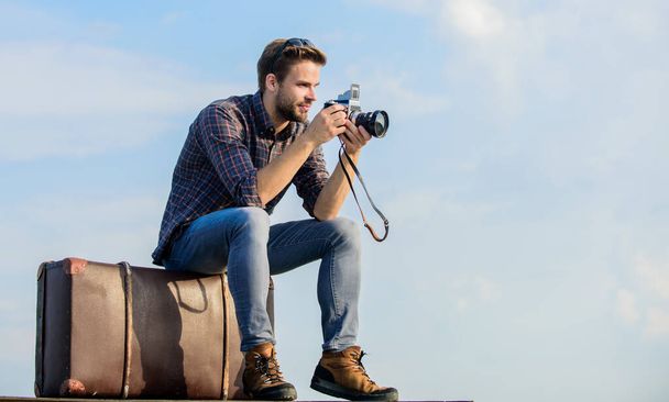 Fuel your soul with travel. traveler wait car. fashion style. looking trendy. macho man with camera on baggage. capture adventure. journalist. photographer in glasses. sexy man touristic reporter - 写真・画像