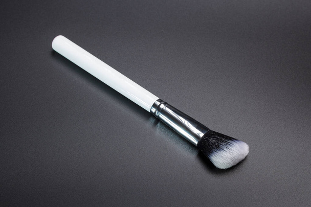 Highlighter make up brush on black background - Photo, Image