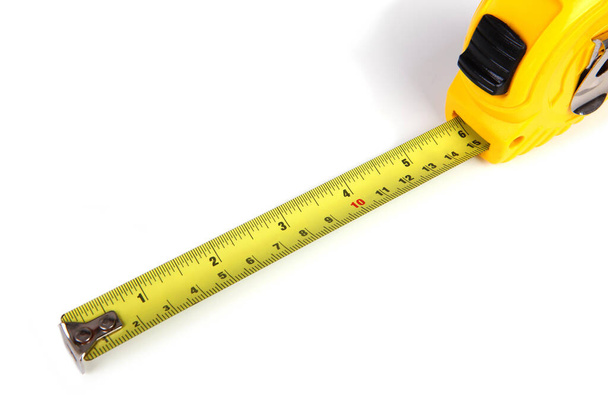 Жовта вимірювальна стрічка ізольована на білому тлі, 6in
. - Фото, зображення