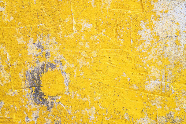 Concrete yellow colorful wall surface texture. Abstract grunge bright color background with aging effect. Copyspace. - Φωτογραφία, εικόνα