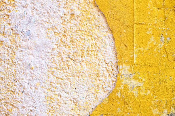 Concrete yellow colorful wall surface texture. Abstract grunge bright color background with aging effect. Copyspace. - Φωτογραφία, εικόνα