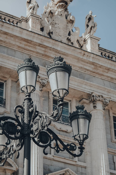 Street lamp against the exterior of Amudena Cathedral (Catedral de la Almudena), a Catholic church in Madrid, Spain. - Fotografie, Obrázek