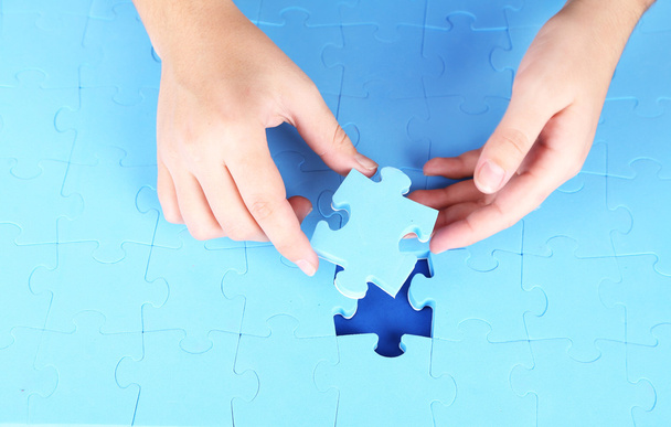 Hand holding puzzle piece, close up - Фото, зображення