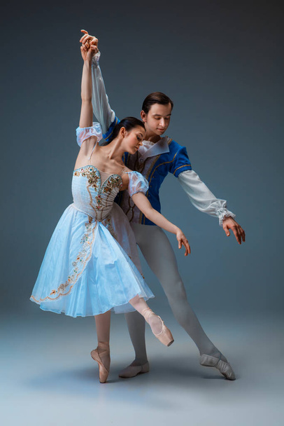 Young and graceful ballet dancers as Cinderella fairytail characters. - Fotó, kép