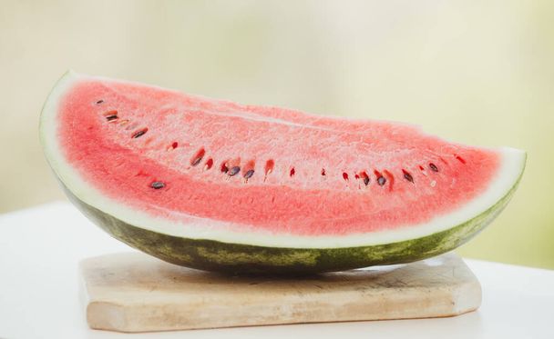 Fresh watermelon slice on wooden background - Photo, Image