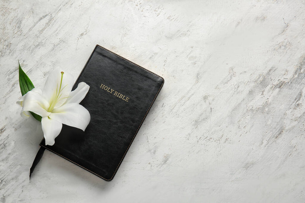 Holy Bible and flower on light background - Photo, Image