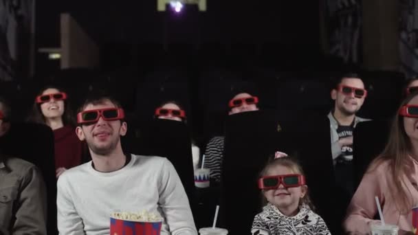 Young people watch movies in cinema: comedy in 3D. - Footage, Video