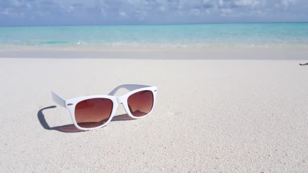 Trendy sunglasses on the beach. Exotic nature of Bora Bora, French Polynesia.  - Footage, Video