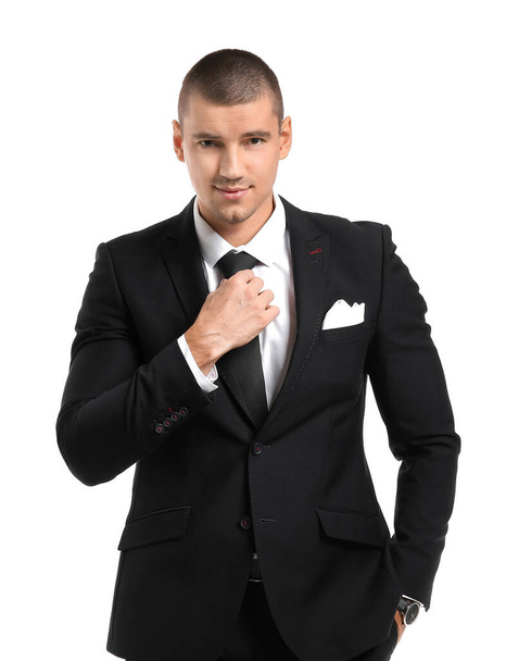 Handsome young man in elegant suit on white background - Photo, Image