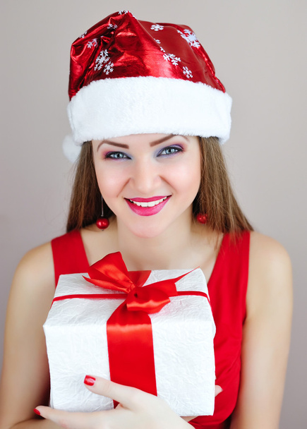 Portrait of beautiful sexy girl with Christmas gift - Fotó, kép
