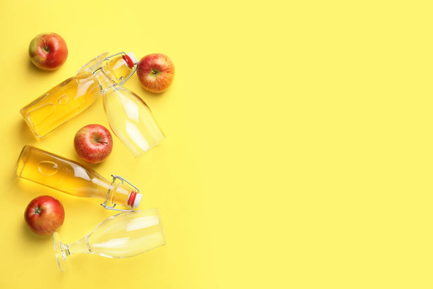 Composition with fresh apple cider on color background - Photo, image