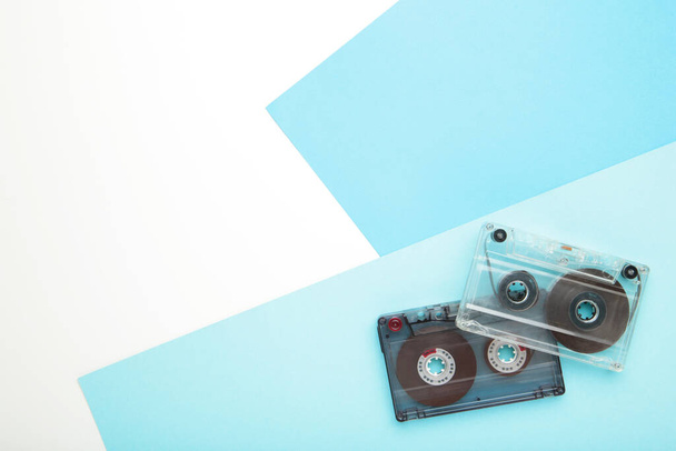 Old cassettes on blue background. Top view - 写真・画像