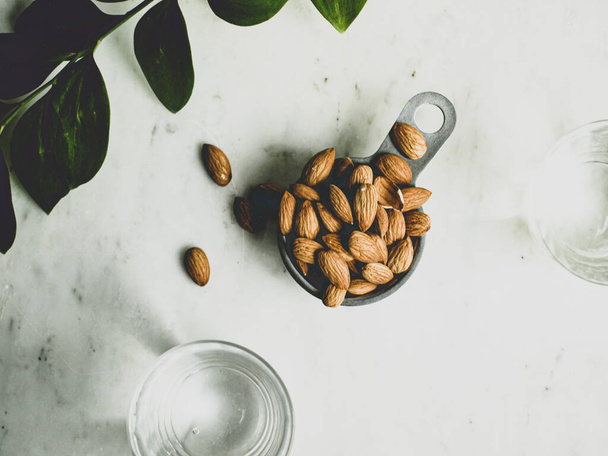 A cup of almonds before making almond milk - 写真・画像
