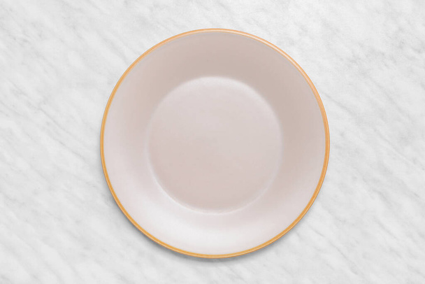 Ceramic plate on light background - Fotografie, Obrázek