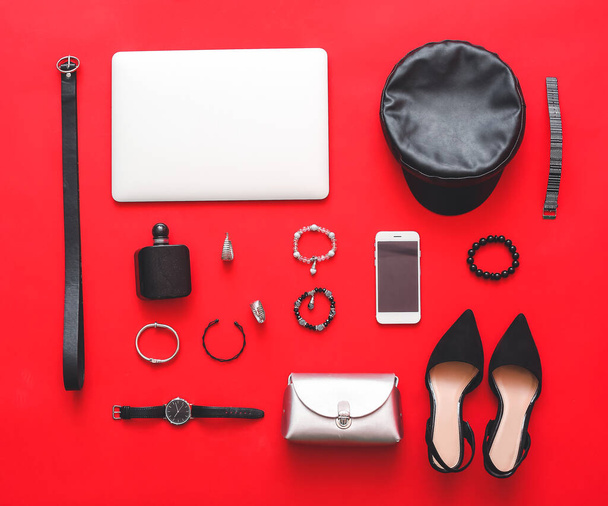 Female accessories with laptop and mobile phone on color background - Photo, Image