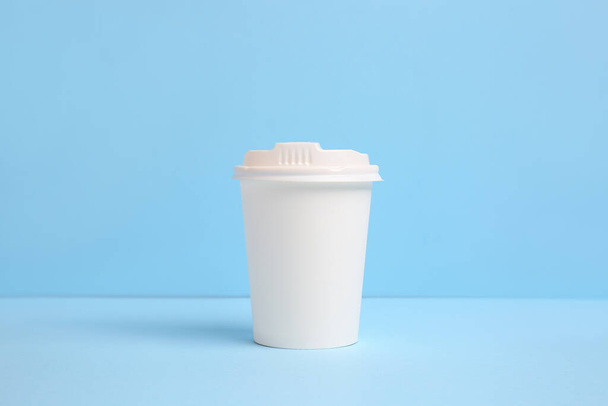 Takeaway cup for drink on color background - Фото, зображення