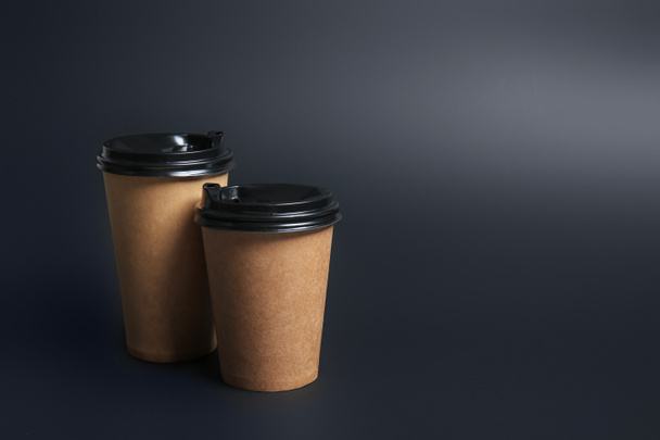 Takeaway cups for drink on dark background - Photo, Image