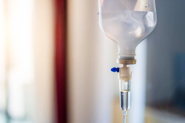 Close up of medical drip or IV drip chamber in patient room,Healthcare concept,  Selective focus. - Fotoğraf, Görsel