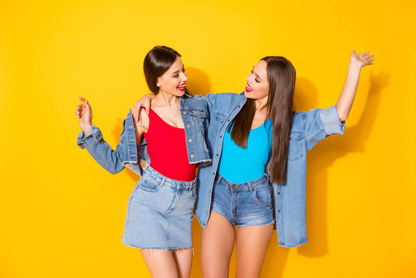 Portrait of enthusiastic lovely funky girls best fellows enjoy together walk weekend feel rejoice wear good look clothes isolated over vivid color background - Fotografie, Obrázek