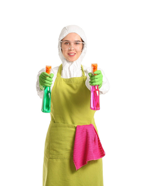 Housewife in protective costume and with cleaning supplies on white background - Fotoğraf, Görsel