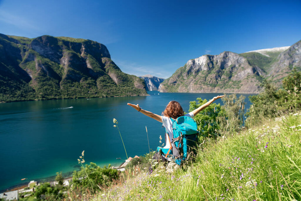 Woman emotional raised hands Travel adventure Lifestyle wanderlust concept vacations outdoor success walk in Norway - Φωτογραφία, εικόνα