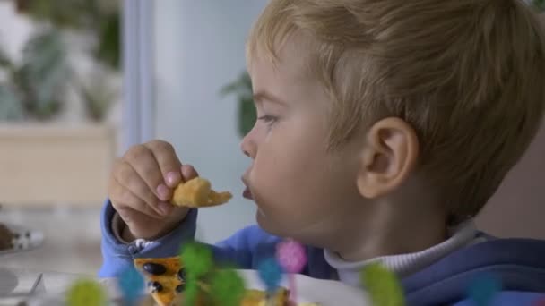 Little Boy Eats Tasty Food During Family Dinner at Home - Video
