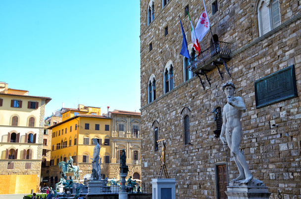 Piazza della Signoria statue of David by Michelangelo and Palazzo Vecchio of Florence view - Fotó, kép