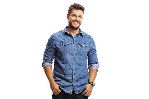Young smiling guy in a denim shirt isolated on white background - Zdjęcie, obraz