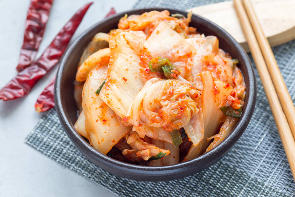 Kimchi cabbage. Korean appetizer in a ceramic bowl, horizontal - 写真・画像