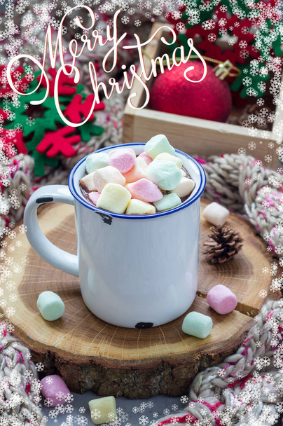 Christmas gift card with lettering and snowflake frame. Hot chocolate topped with marshmallow in enamel mug - Fotoğraf, Görsel