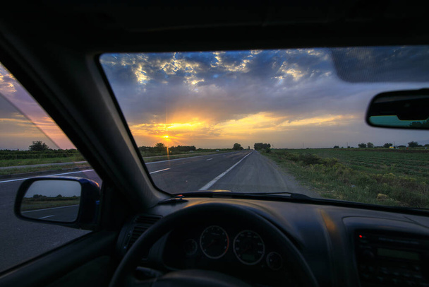 Sunset view inside the car.  - Photo, Image