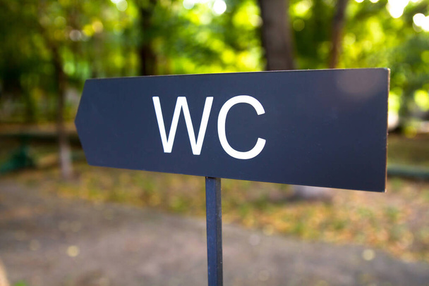 WC sign in the garden.  - Fotó, kép